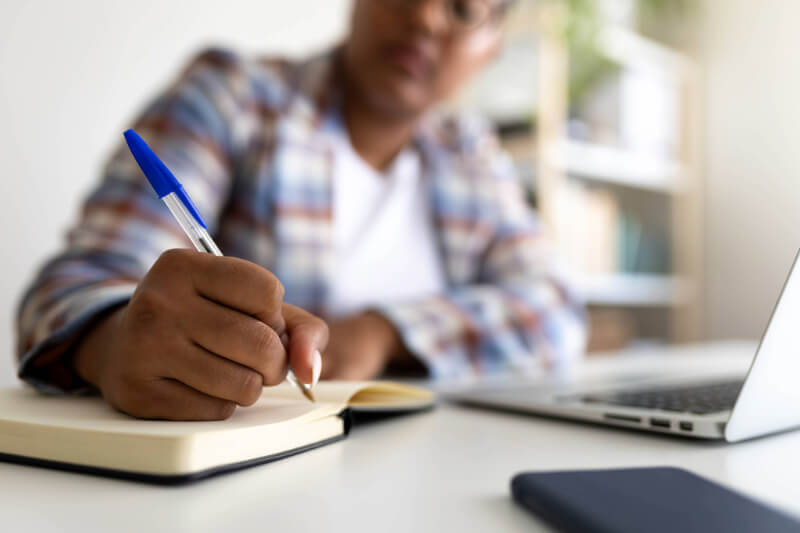 Member working on daily administrative tasks inside the LBS mental health clubhouse.